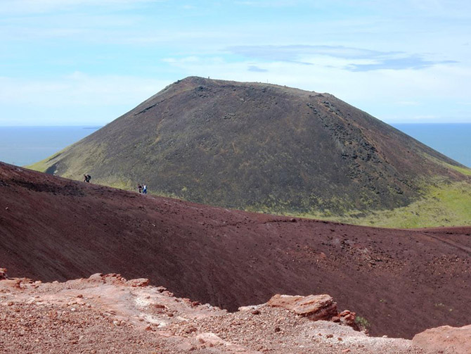 The volcano Helgafell and the rim of Eldfell on Heimaey Island, site of the 1973 eruption