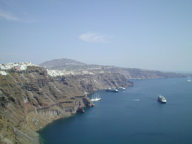 The main island town of Fira nestling above the caldera wall