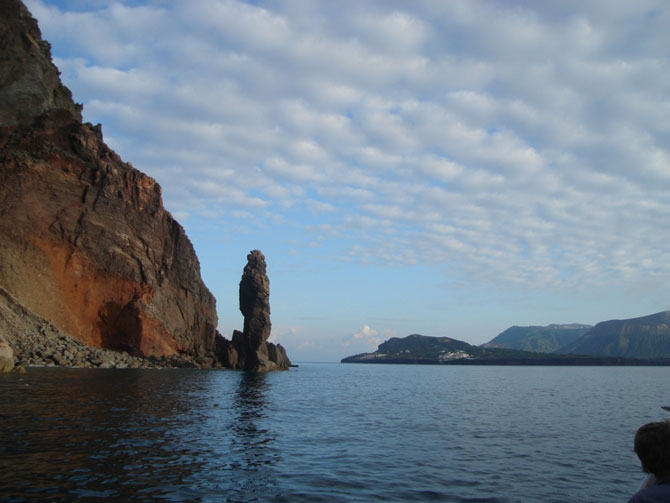 A coastal stack and cliffs in volcanic rocks on the south-western tip of Lipari island