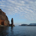 A coastal stack and cliffs in volcanic rocks on the south-western tip of Lipari island